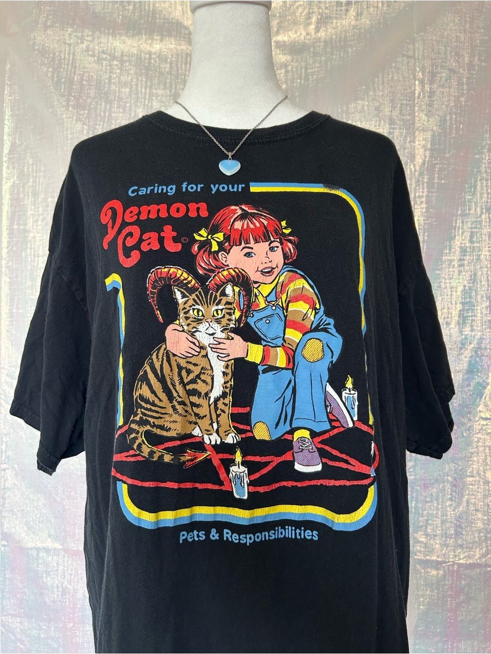 Spencer's Black Caring for Your Demon Cat Graphic Tee with Multicolor Print.